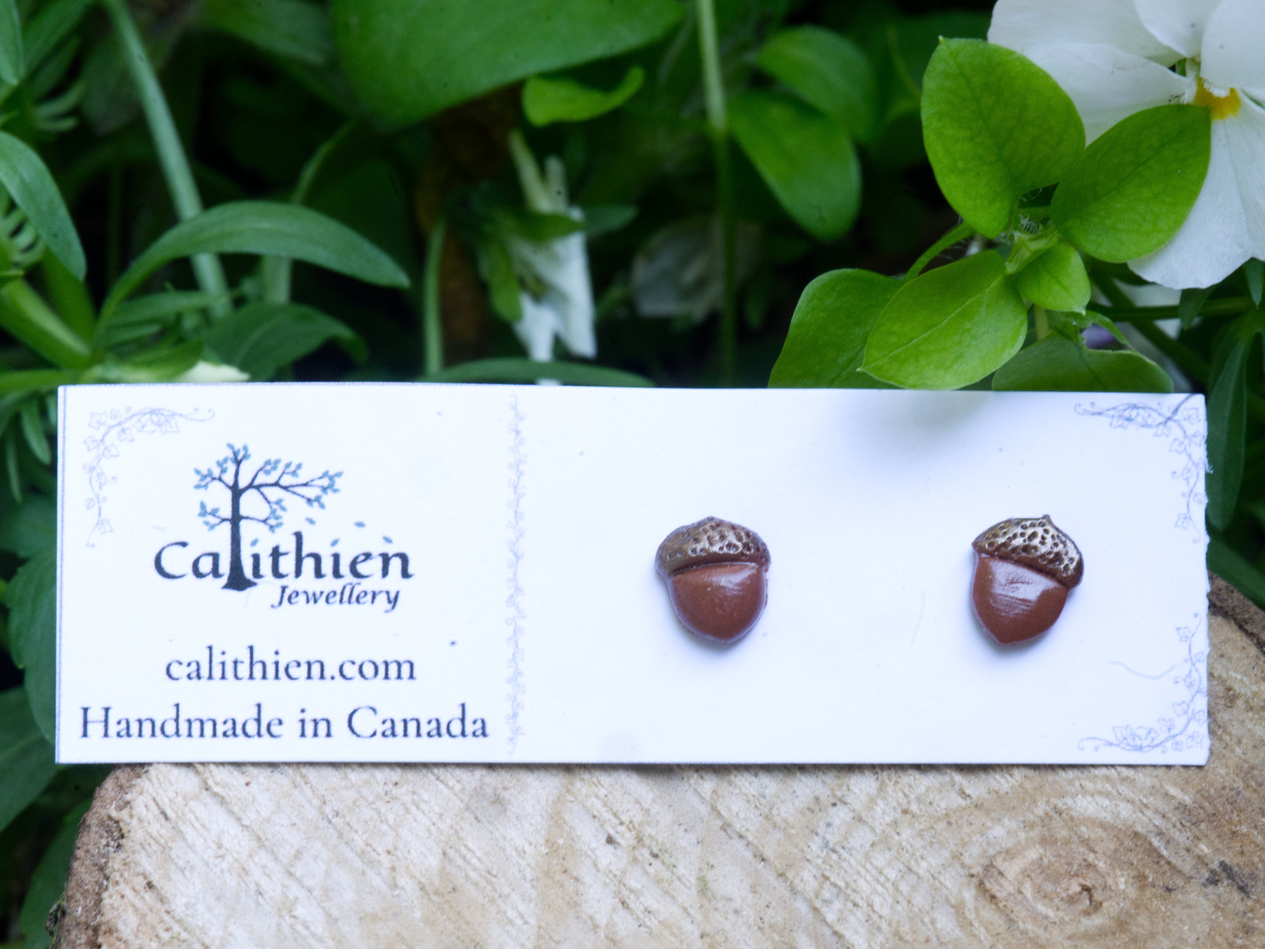 Acorn stud earrings on Calithien Jewellery branded display card reading Handmade in Canada