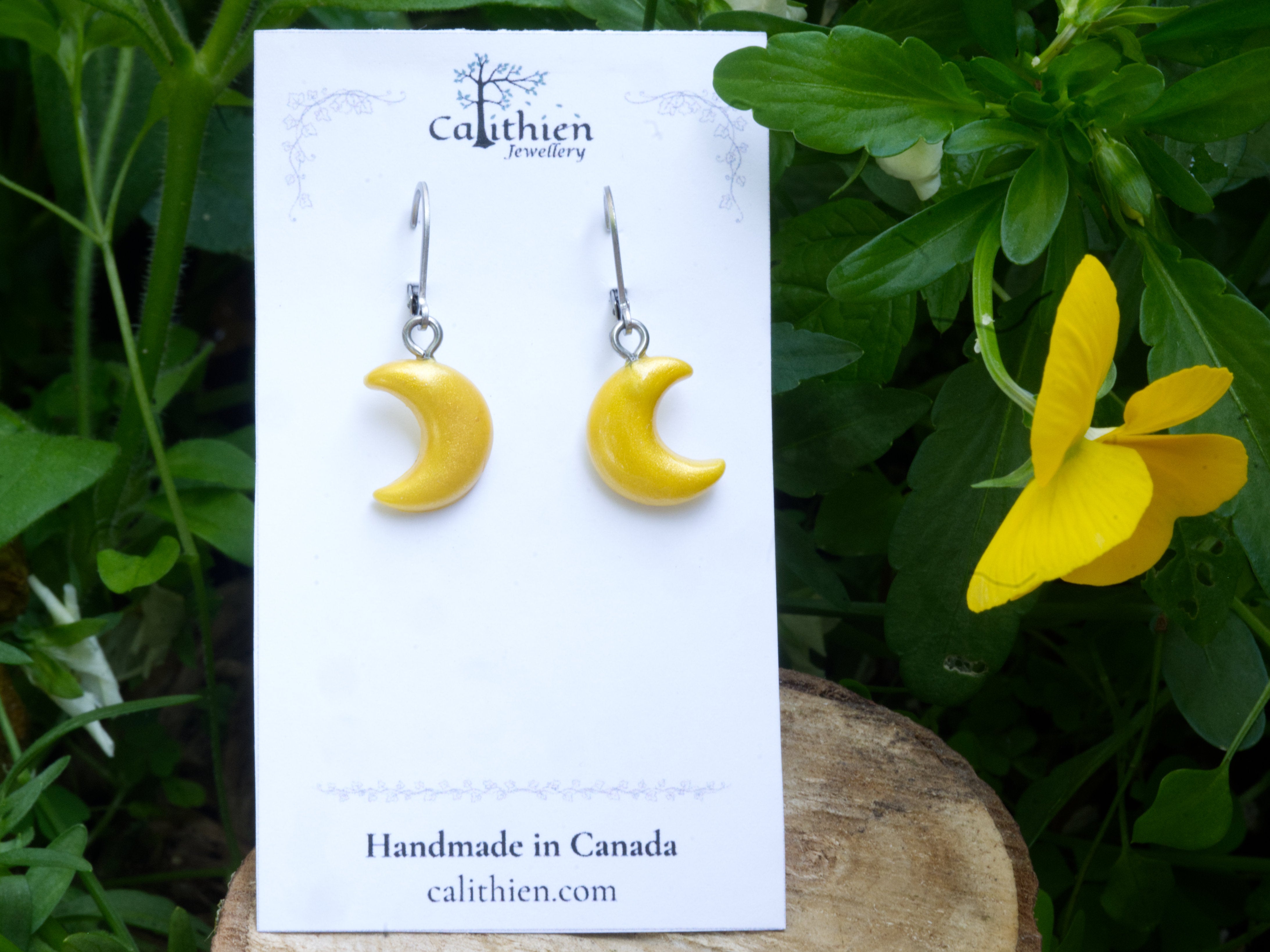 Crescent moon leverback earrings on Calithien Jewellery branded display card reading Handmade in Canada