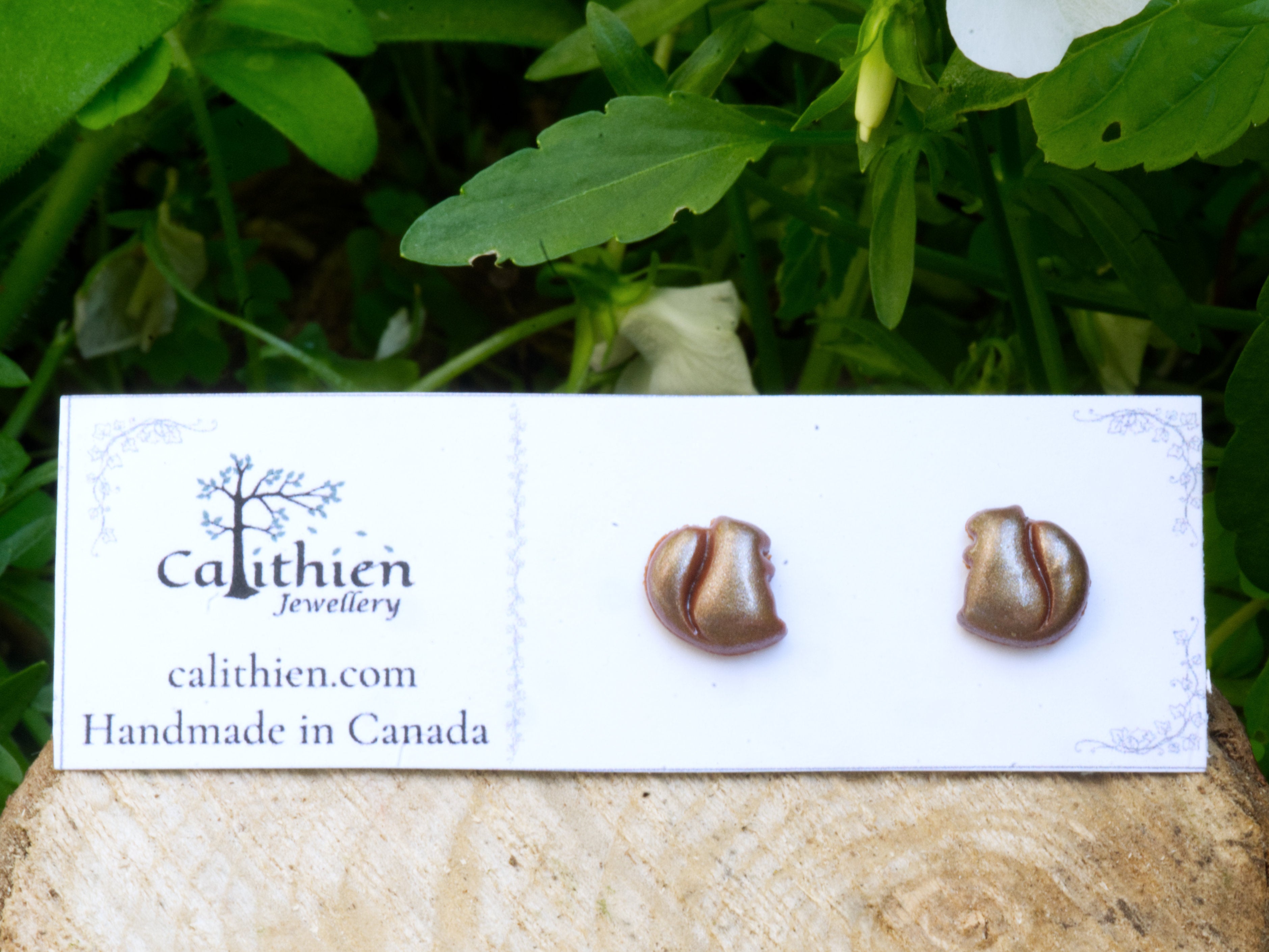 Squirrel stud earrings on Calithien Jewellery branded display card reading Handmade in Canada