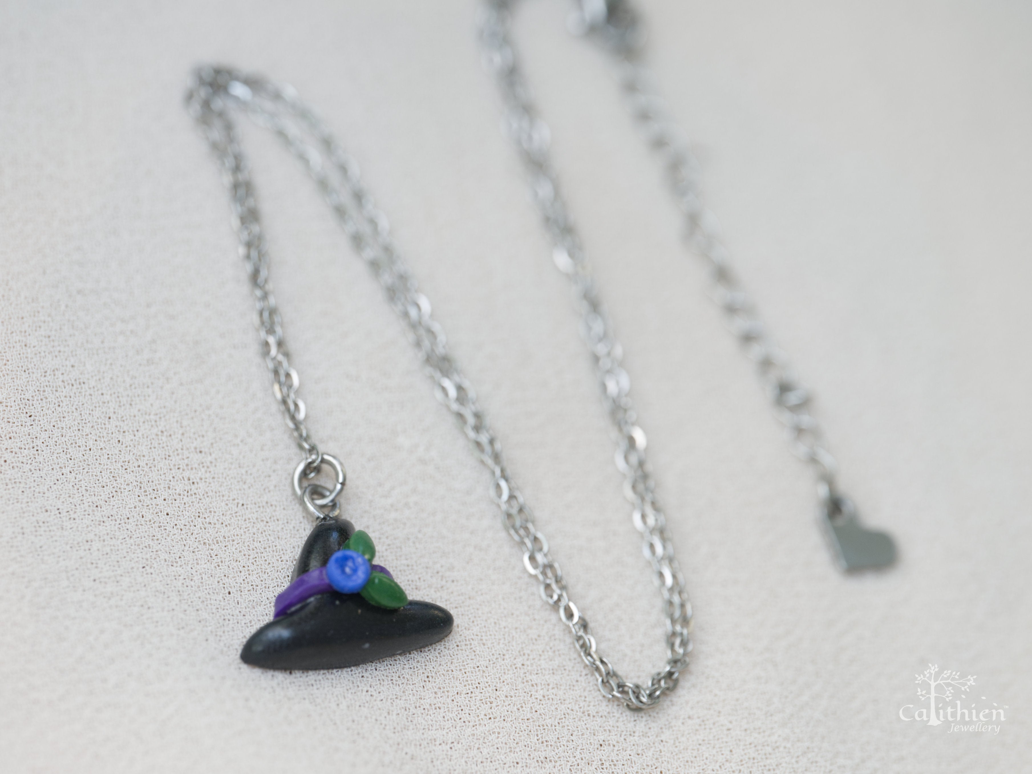 304 stainless steel chain and bail shown with black polymer clay witch hat pendant