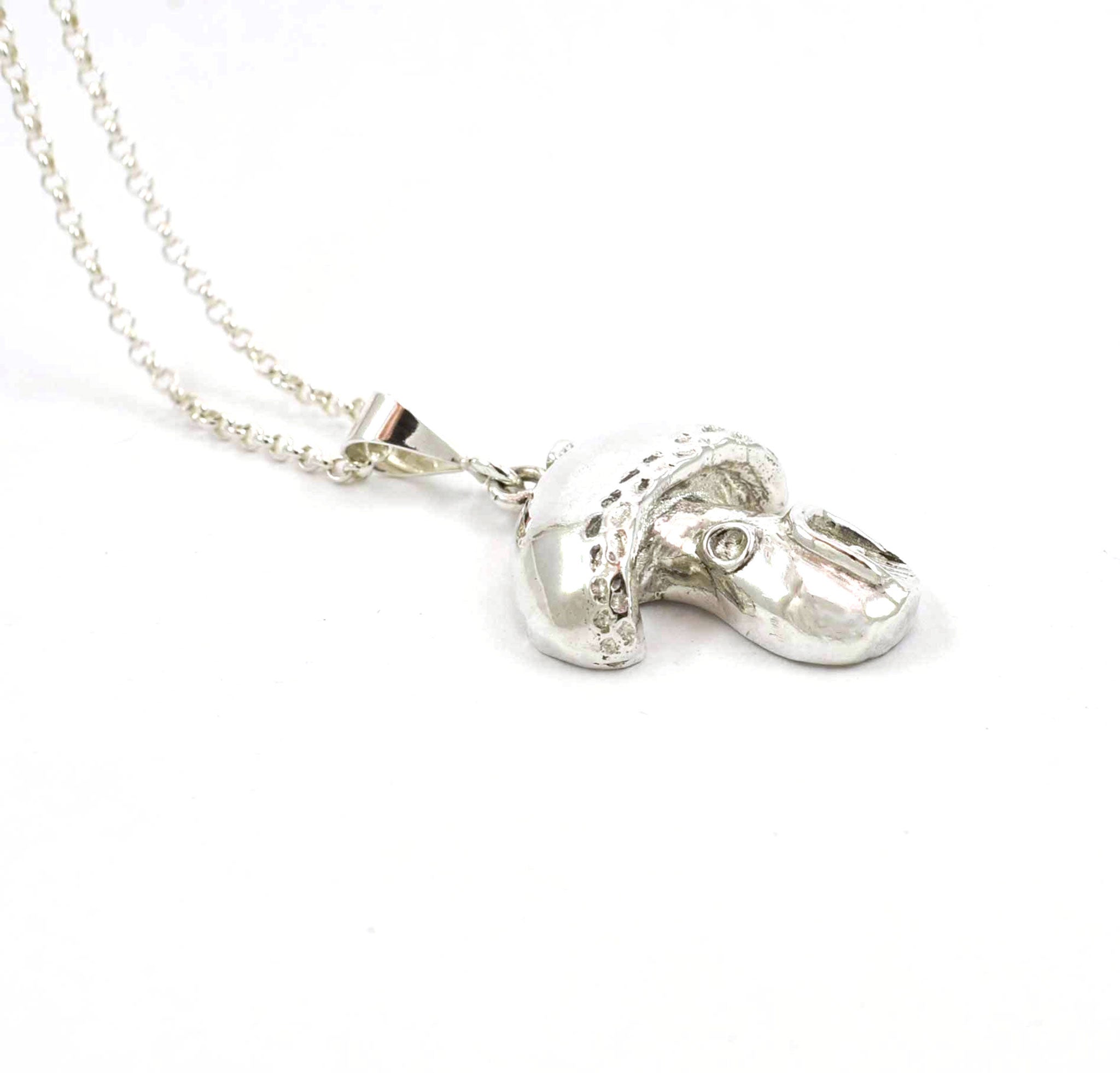 Left side view of sterling silver Faery House pendant