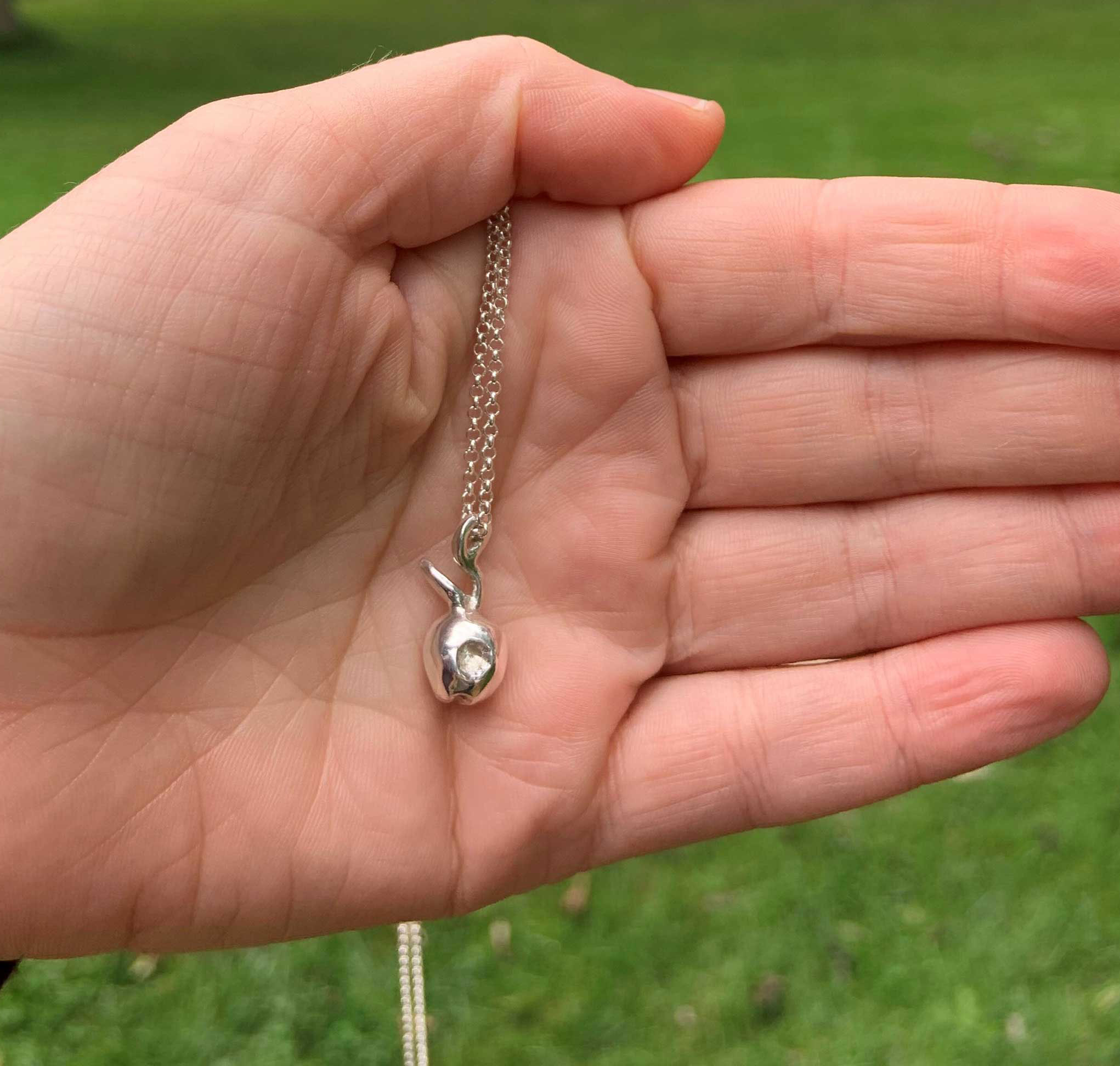 Front view of sterling silver apple pendant