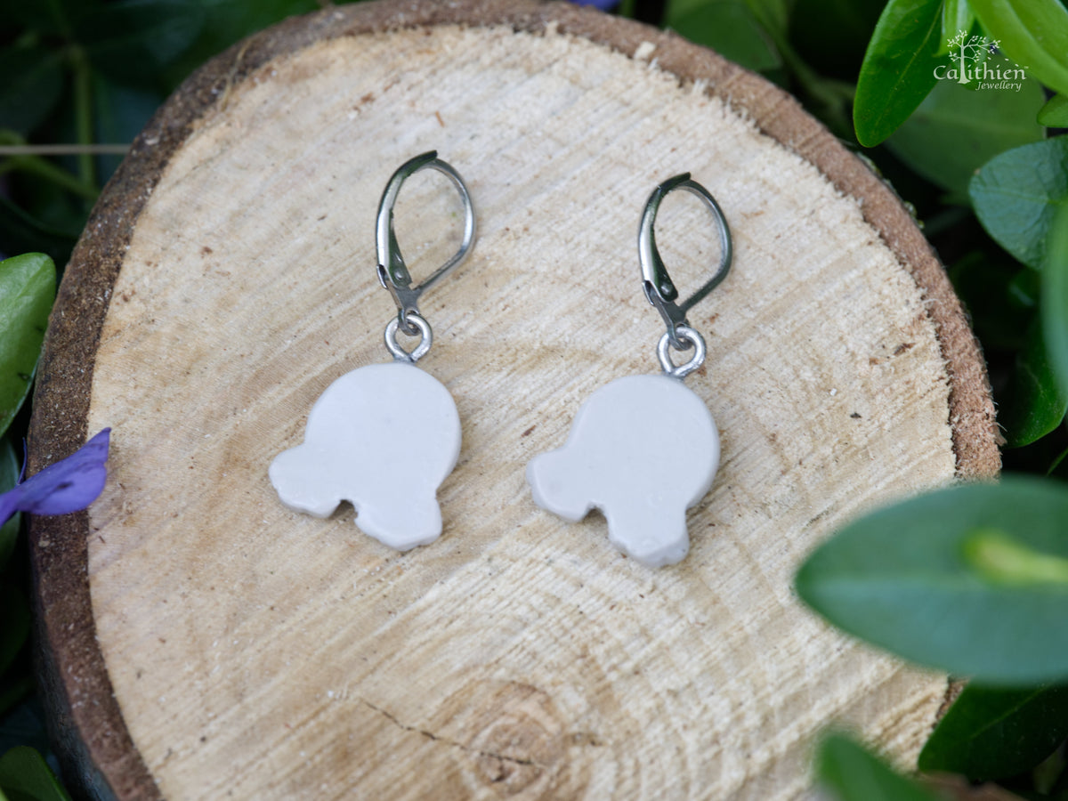 View of the backs of the bunny bum dangle earrings