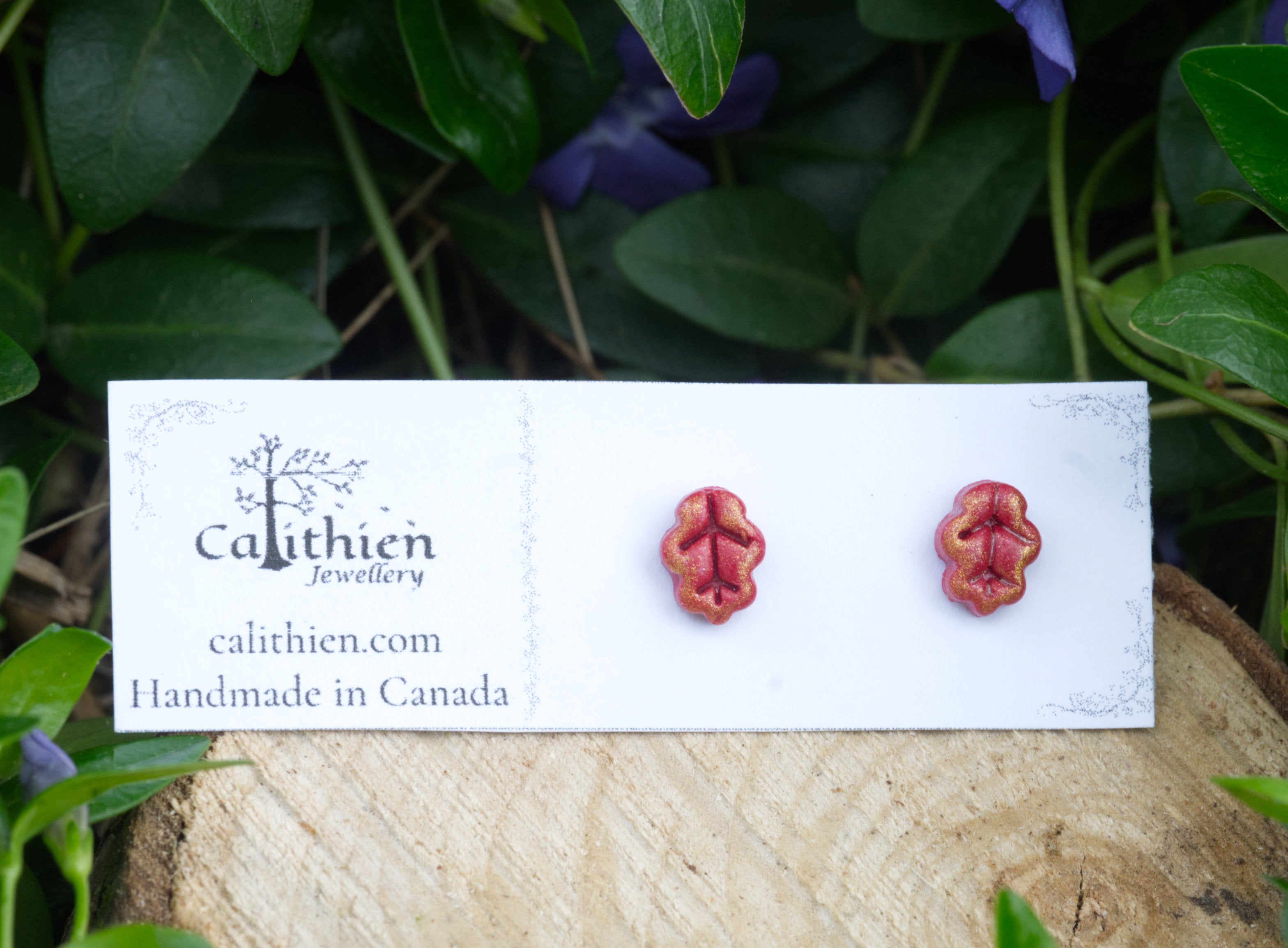 Oak leaf stud earrings on Calithien Jewellery branded display card reading Handmade in Canada