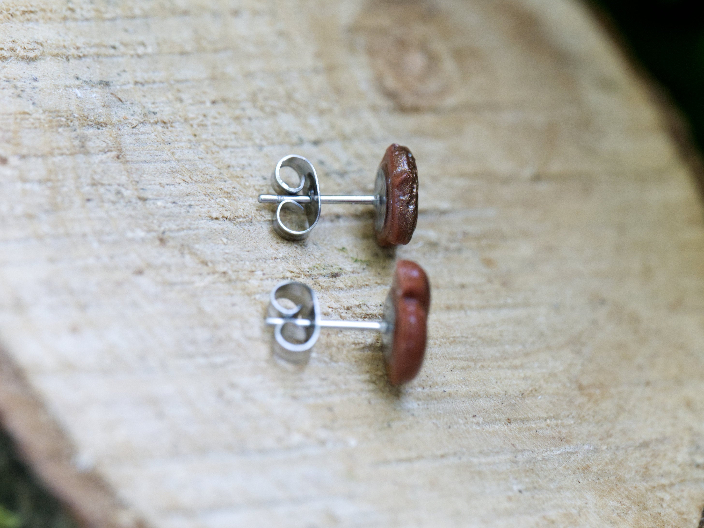 316 grade surgical steel earring posts and butterfly backs on mismatched squirrel and acorn stud earrings