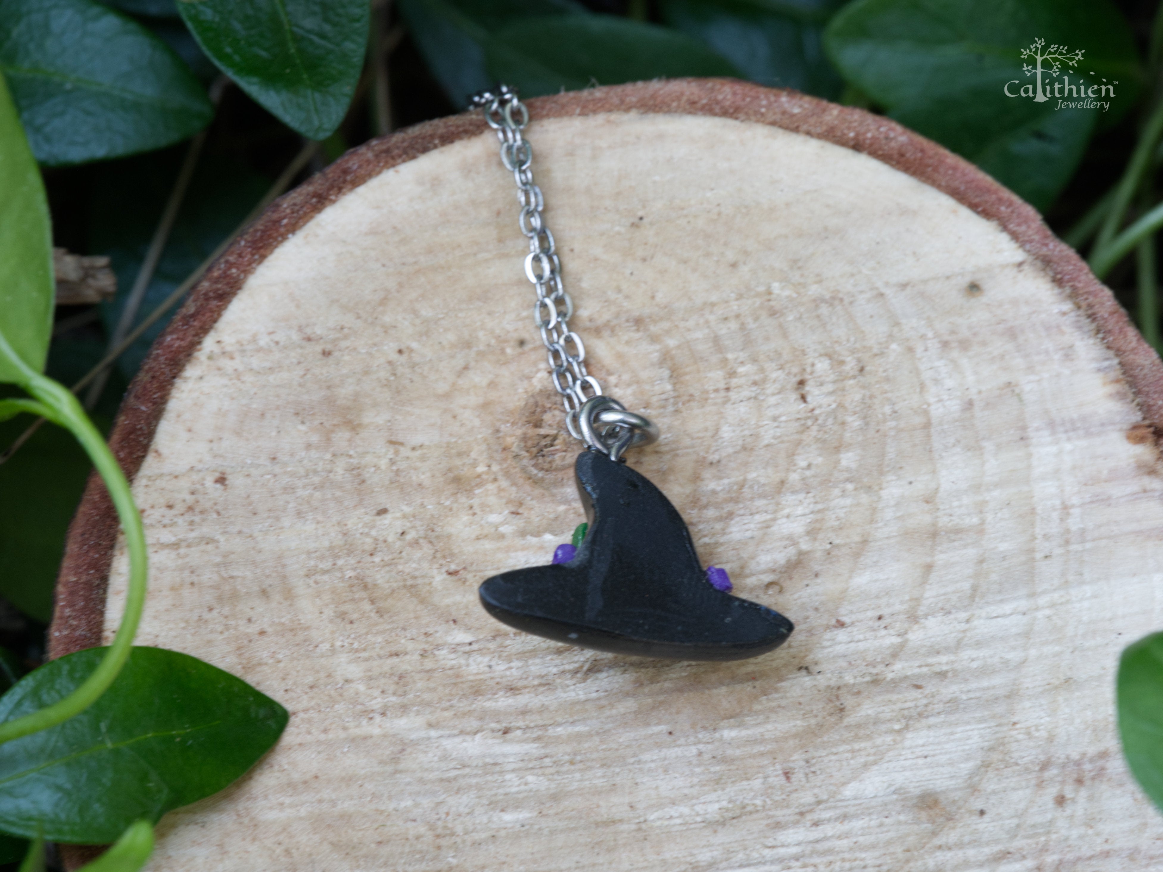 Back view of black witch hat polymer clay pendant showing  with matte finish