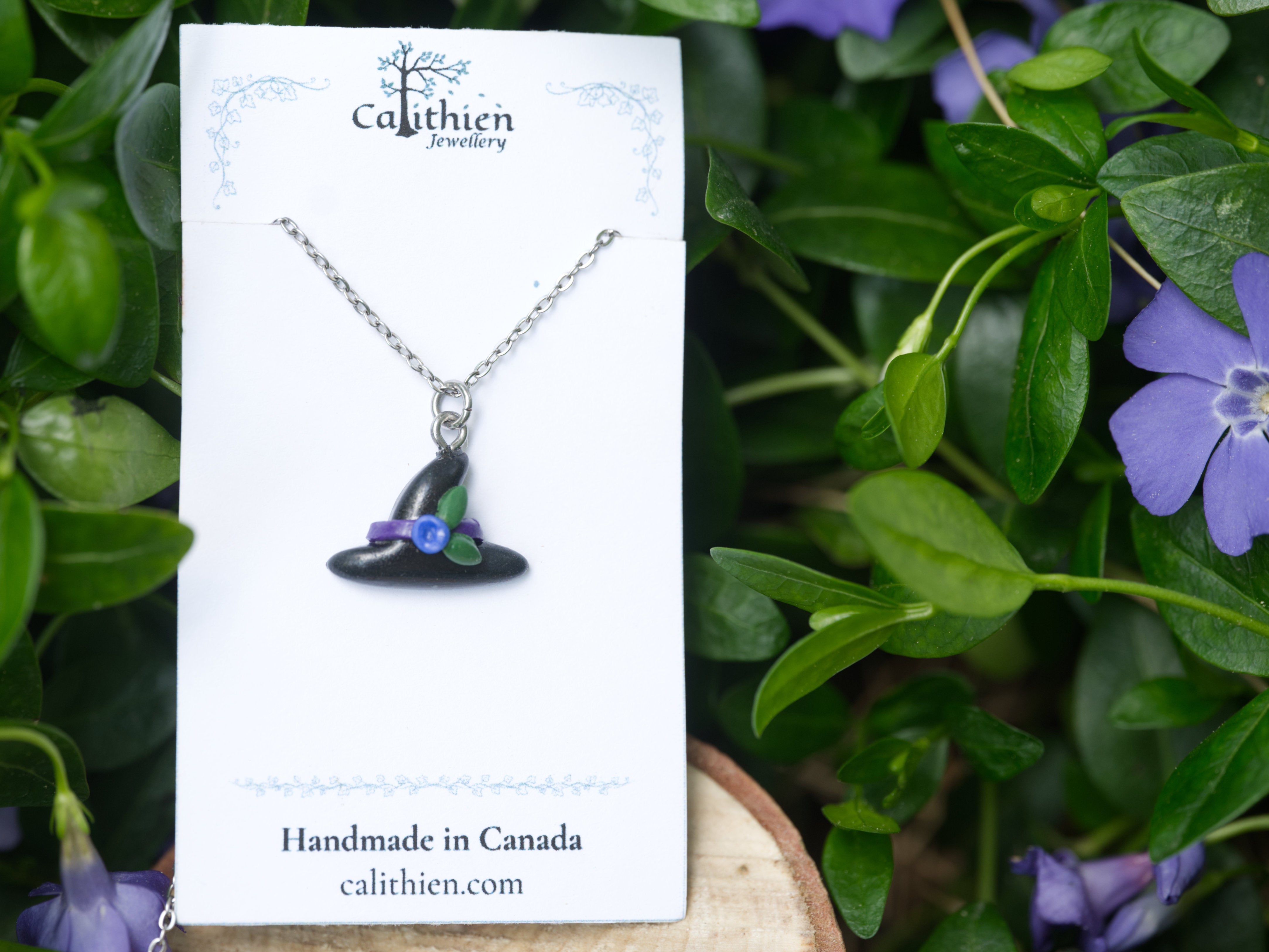 Witch hat pendant necklace on Calithien Jewellery branded display card reading Handmade in Canada