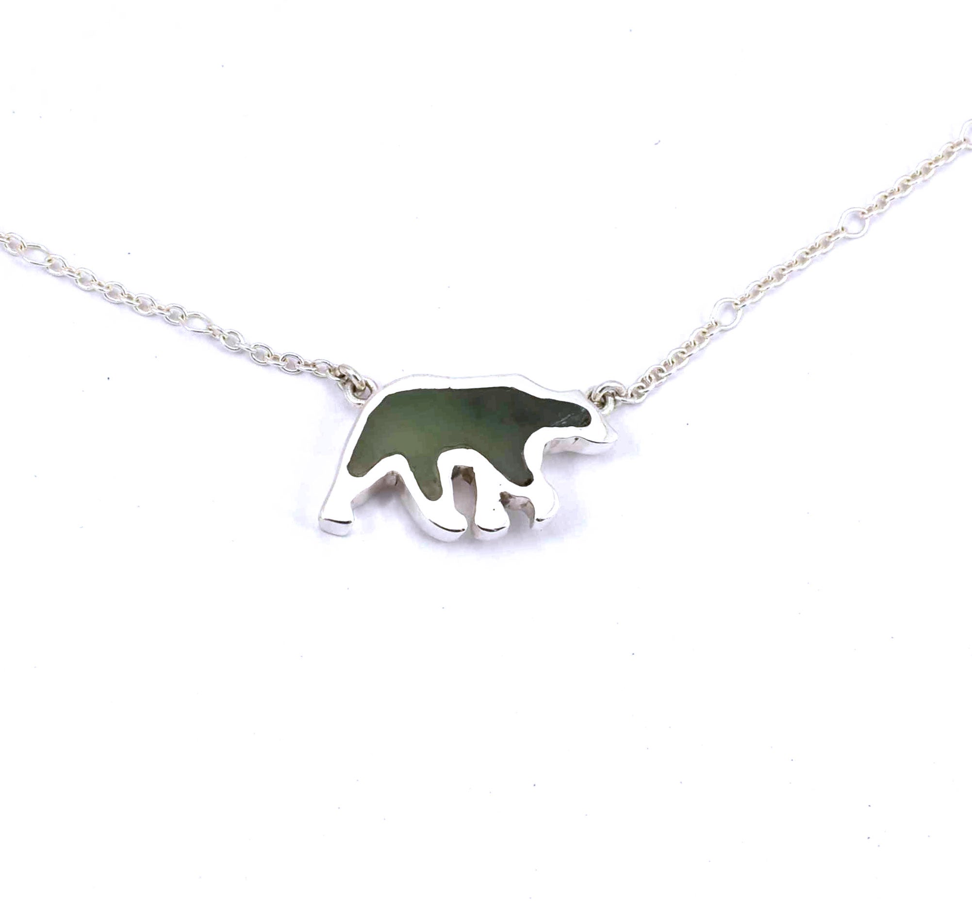 Front view of sterling silver bear pendant with jade gemstone inlay
