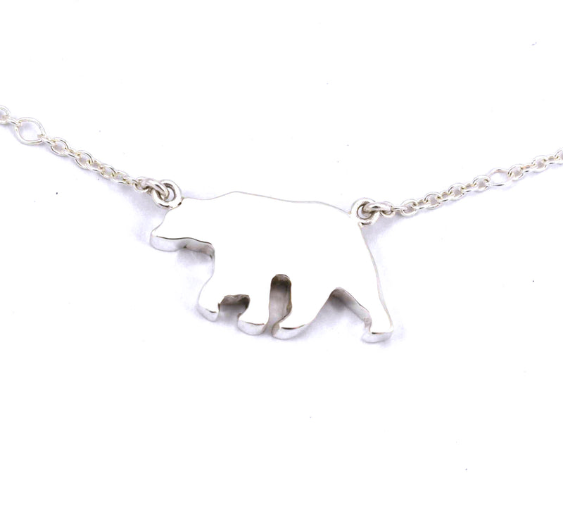 Rear view of sterling silver bear pendant with jade gemstone inlay