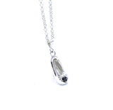 Front view of sterling silver cinderella's slipper pendant with blue sapphire