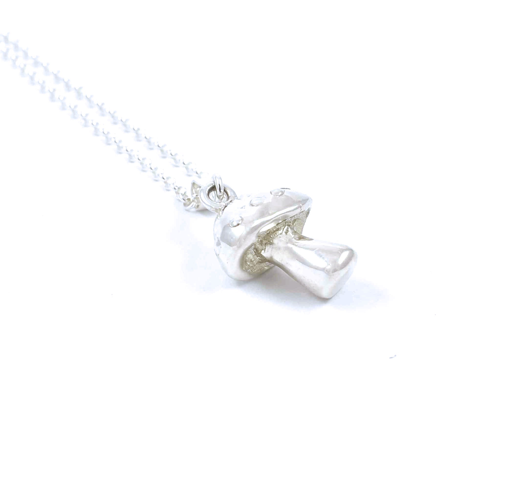 Left side view of sterling silver mushroom pendant