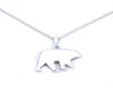 Rear view of medium sterling silver bear pendant with tree accent and crushed gemstone inlay